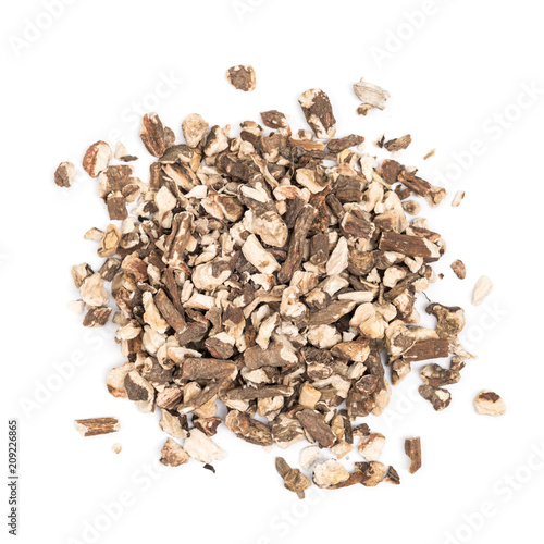 Organic dried dandelion root isolated on white background, top view