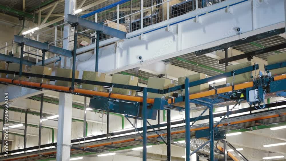 Packages On Conveyor Belt In Distribution Warehouse Packages On Conveyor Belt In Distribution Warehouse