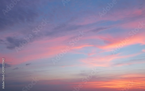 Beautiful pink sunset on blue sky background 