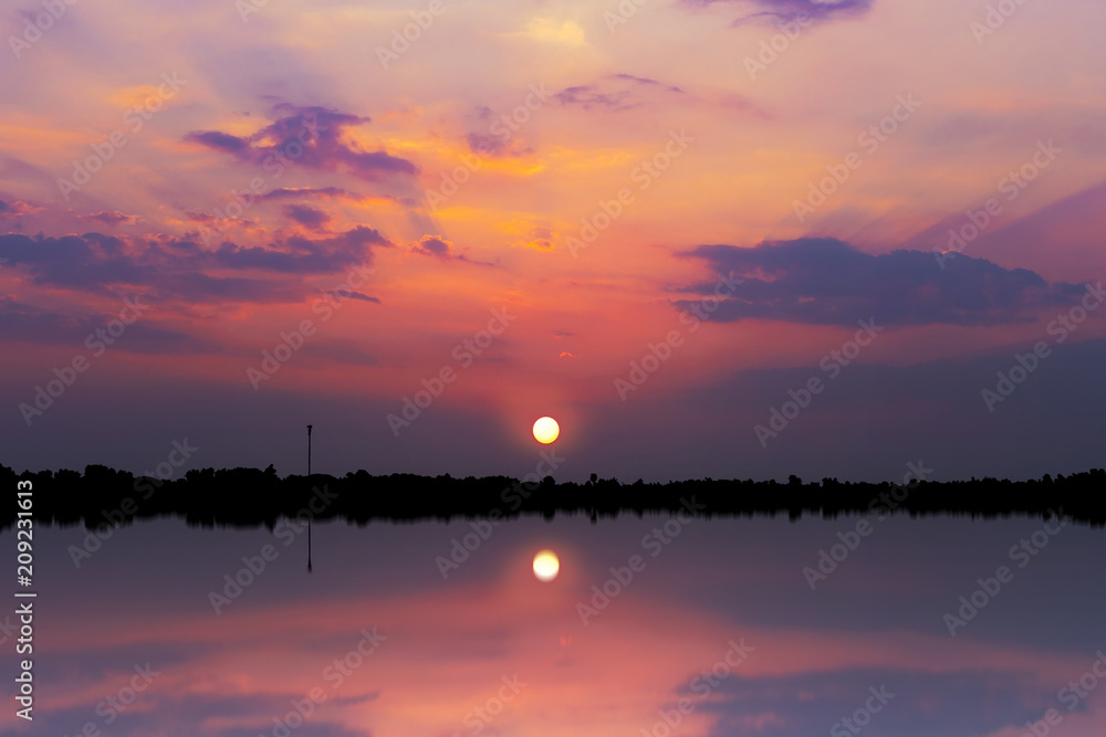 Scenic view of beautiful sunset above the river. Colorful sky with clouds in evening time, colorful sky background