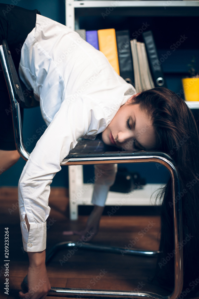 Lady sleeping on back of chair. Close portrait of beautiful office lady  wearing white button up shirt fallen asleep on office chair in weird  position. Stock Photo | Adobe Stock