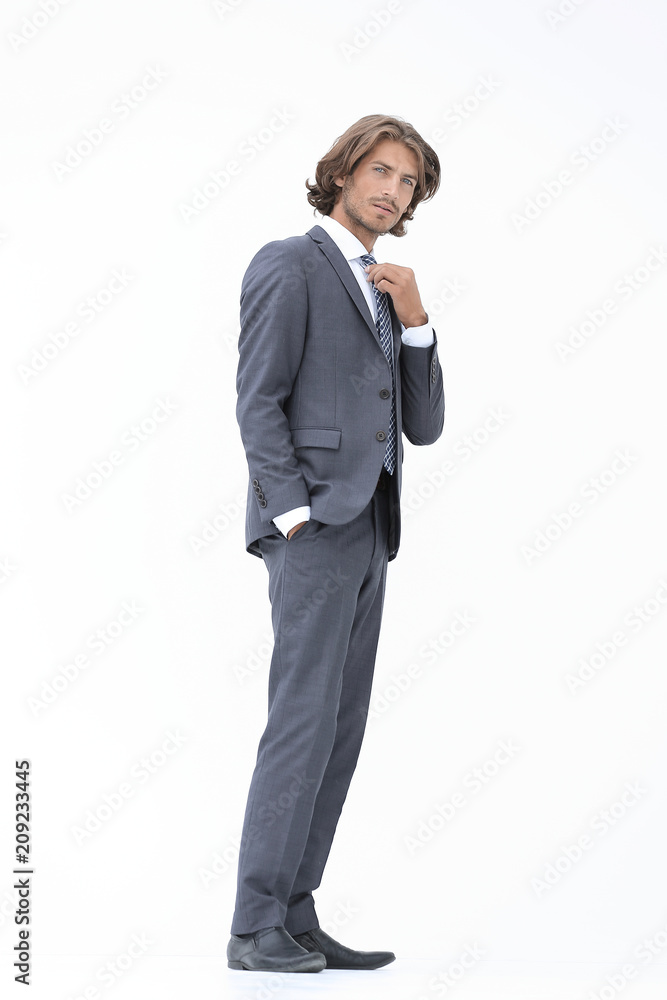 businessman straightening his tie isolated on a white background businessman straightening his tie isolated on a white background