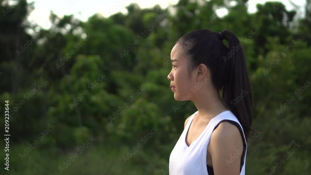 Young woman walking in the park Young woman walking in the park