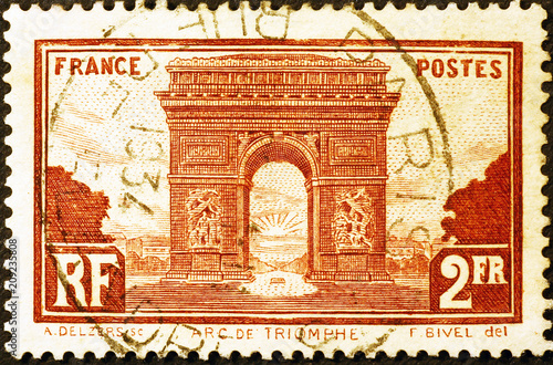 Arc de Triomphe of Paris on vintage postage stamp photo