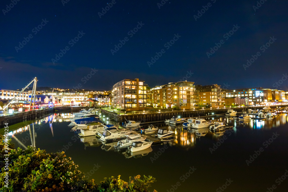 View of the marina and port in Trondhemi at night. Norway. Skyline of city. 