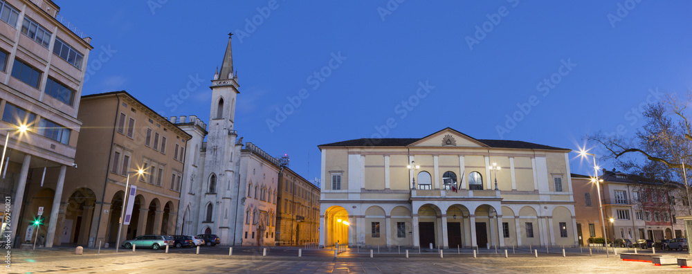 Reggio Emilia - Piazza della Vittoria, Teather Ariosto and Galleria Parmeggiani at dusk.