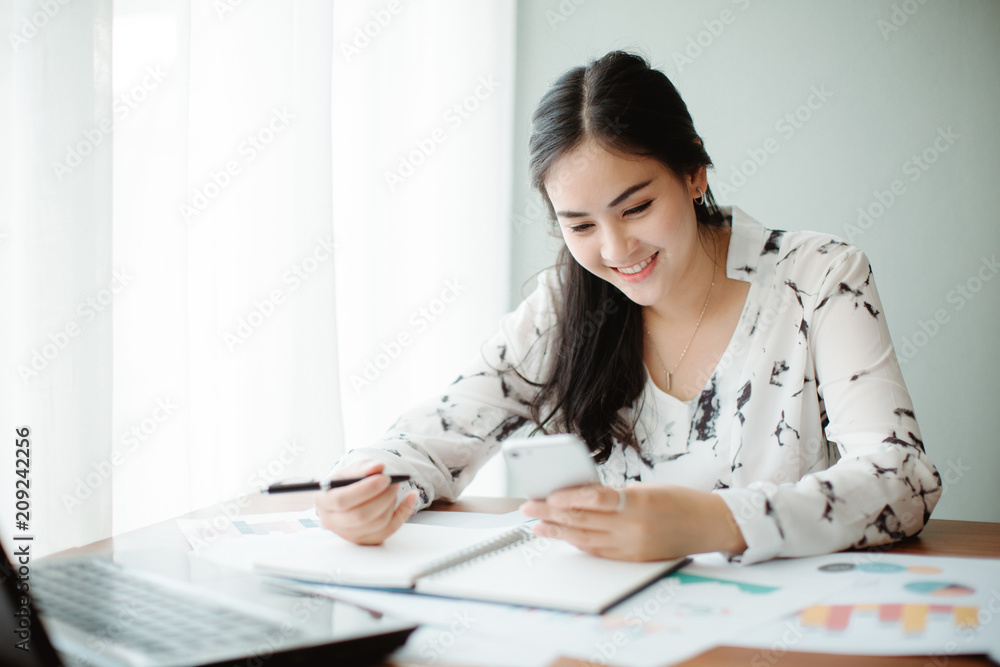 Beautiful young Asia woman working in office Beautiful young Asia woman working in office