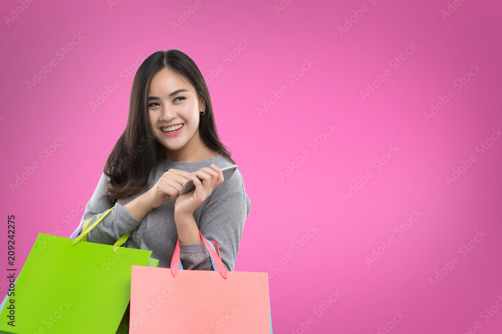 Very happy beautiful young woman in casual clothing with shopping bags Very happy beautiful young woman in casual clothing with shopping bags