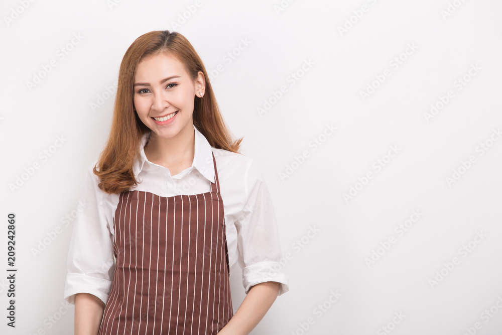 Beautiful happy young woman wearing kitchen apron , isolated on white Beautiful happy young woman wearing kitchen apron , isolated on white