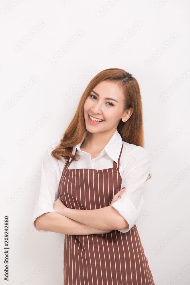 Beautiful happy young woman wearing kitchen apron , isolated on white Beautiful happy young woman wearing kitchen apron , isolated on white