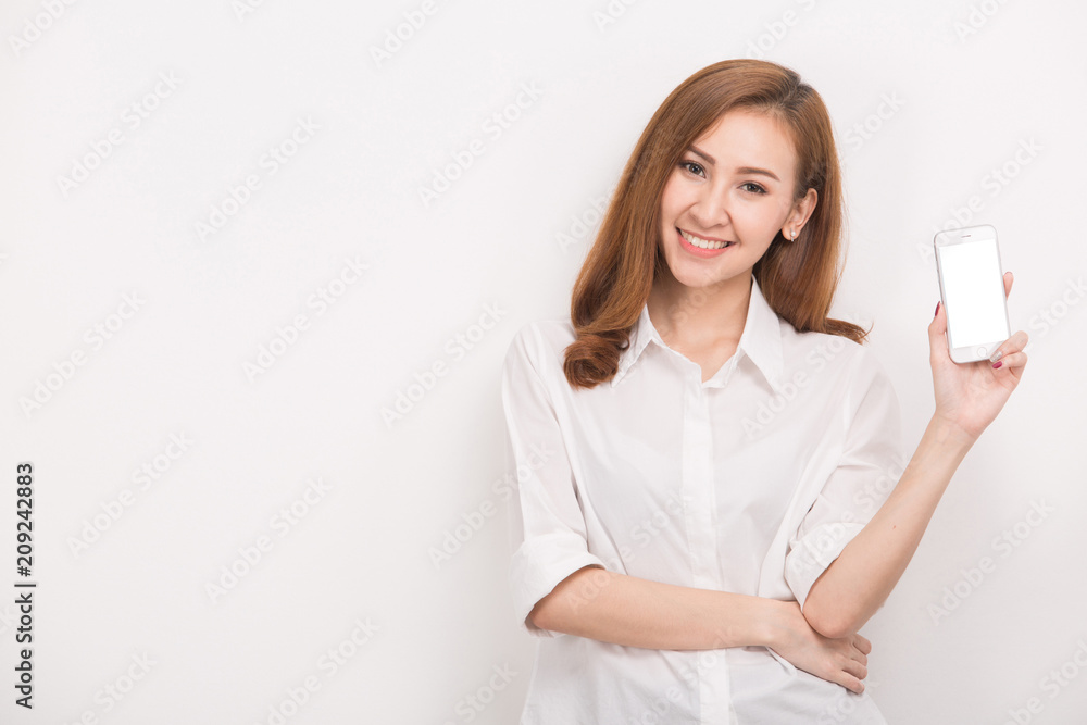Young beautiful woman holding blank screen smart phone on white background Young beautiful woman holding blank screen smart phone on white background