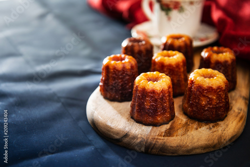 Canele is a small French pastry with rum and vanilla photo