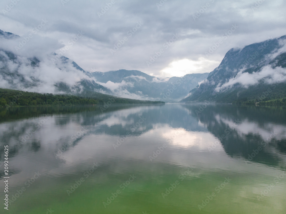Fototapeta premium Cloudscape over Bohinj Lake in Slovenia, aerial drone view
