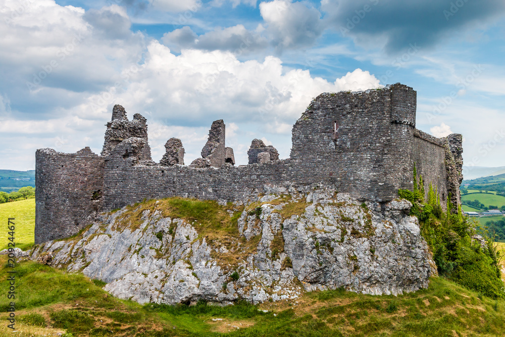 Imposing exterior walls of an ancient ruined castle (Carreg Cennen, Wales) Imposing exterior walls of an ancient ruined castle (Carreg Cennen, Wales)