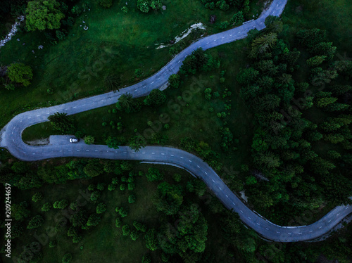 Top down view on countryside road in forest,aerial drone