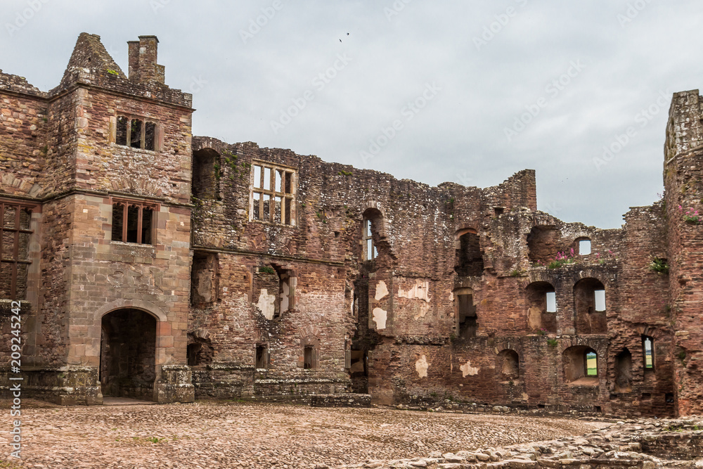 Inside the courtyard and walls of a ruined medieval castle (Raglan Castle)