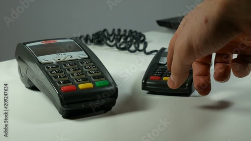 person conducts a credit card on the terminal