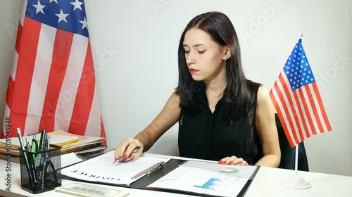 business lady signs a contract and invests money