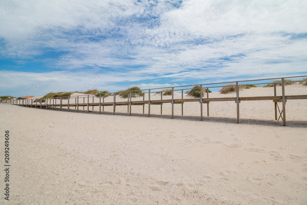 Wooden footbridge at the sand beach in Portugal Wooden footbridge at the sand beach in Portugal