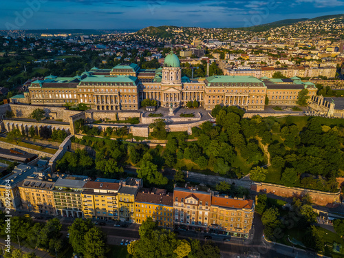 Budapest, Hungary - Aerial view of the famous Buda Castle Royal palace and Varkert bazaar at sunrise with Buda side and Buda Hills at background © zgphotography