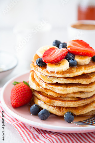 Homemade pancakes with berries and banana