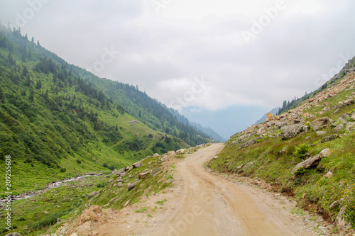 Dirt road in the valley © emrekaya