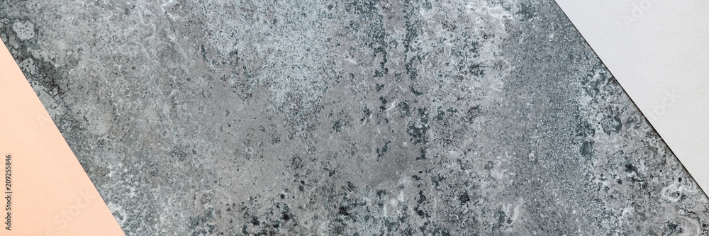 Panoramic view on concrete top in advance with sheets of gray and pink handmade paper mockup Panoramic view on concrete top in advance with sheets of gray and pink handmade paper mockup