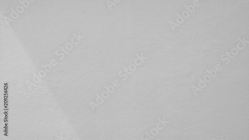 white concrete wall with shadow from window - background