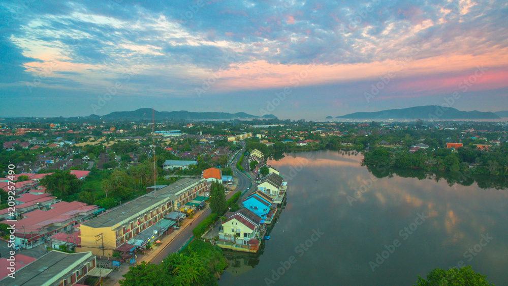 aerial photography above the large lagoon behind Chalong temple. reflect of sunset on the lagoon