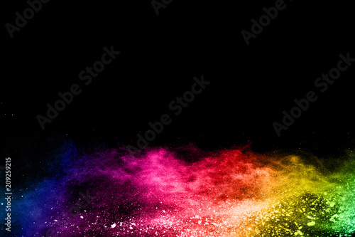 Multicolor powder explosion on black background. 