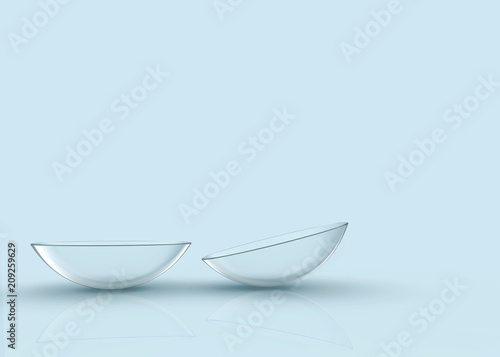 3d rendering. Thin clear contact lens on light blue background.