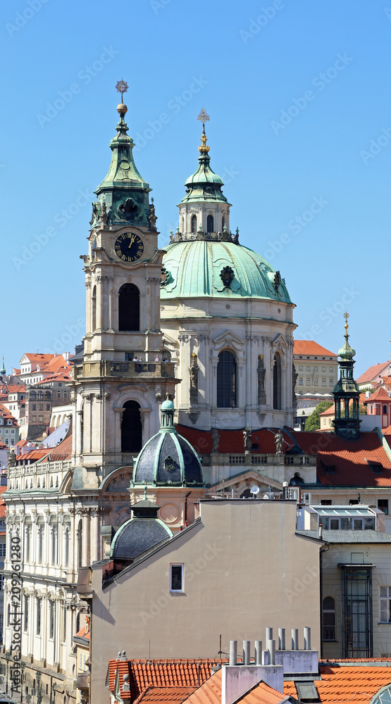 dome and the bell towers with the clock of the ancient church of