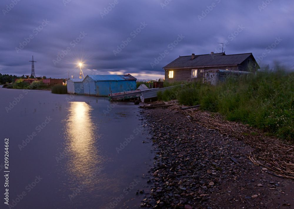 Night scene of a village in the Russian province.