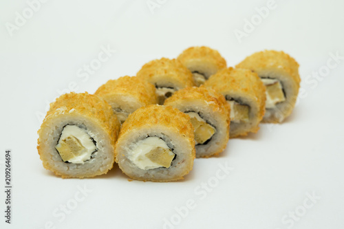 tasty fresh sushi rolls lying on a white background