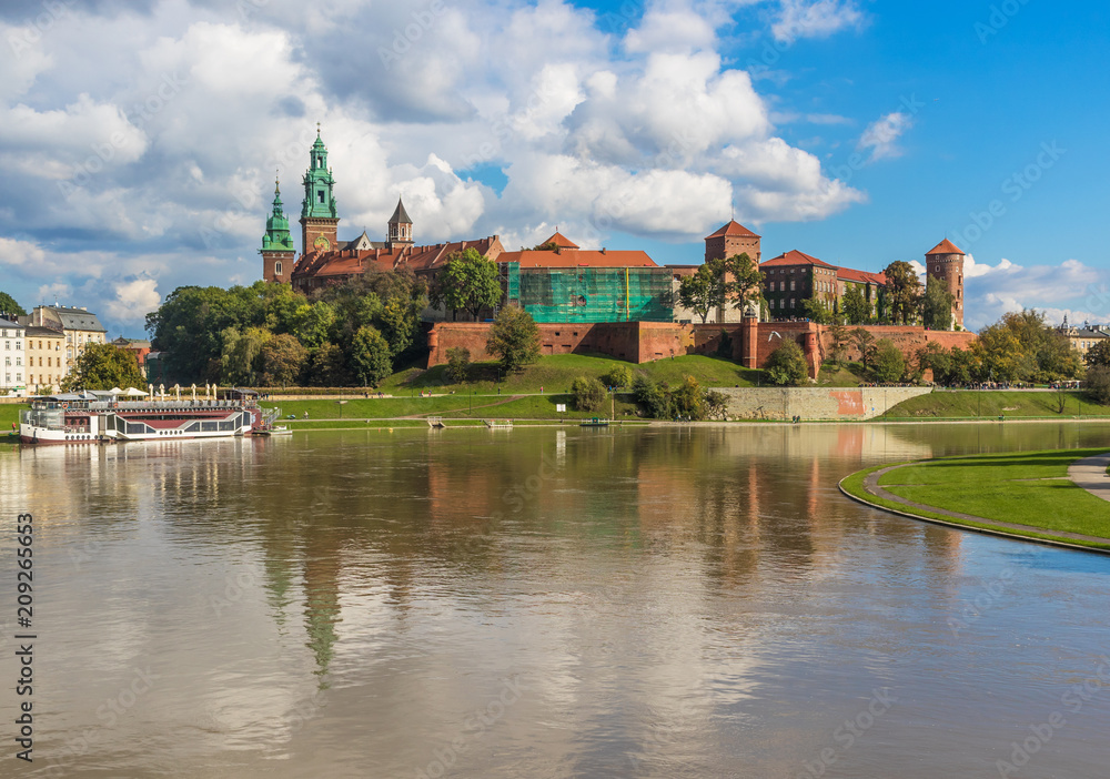 Krakow, Poland - the second biggest city in Poland, Krakow offers a mix of history and modernity. Here in the picture a perspective of the Old Town and the famous Wawel Castle, on the Vistula river