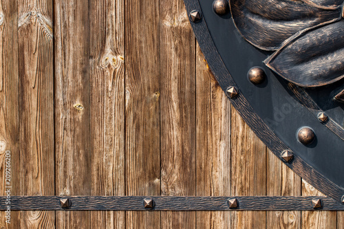 wooden gate with wrought iron elements close up