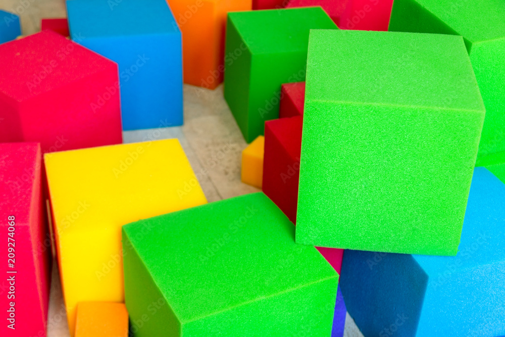Multicolored soft foam cubes at children playground. Bright colorful toys. Kids party entertainment and decoration Multicolored soft foam cubes at children playground. Bright colorful toys. Kids party entertainment and decoration