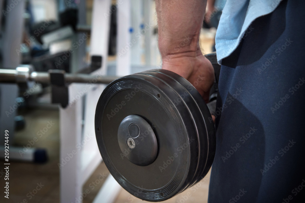 Muscular man during workout in the gym Muscular man during workout in the gym