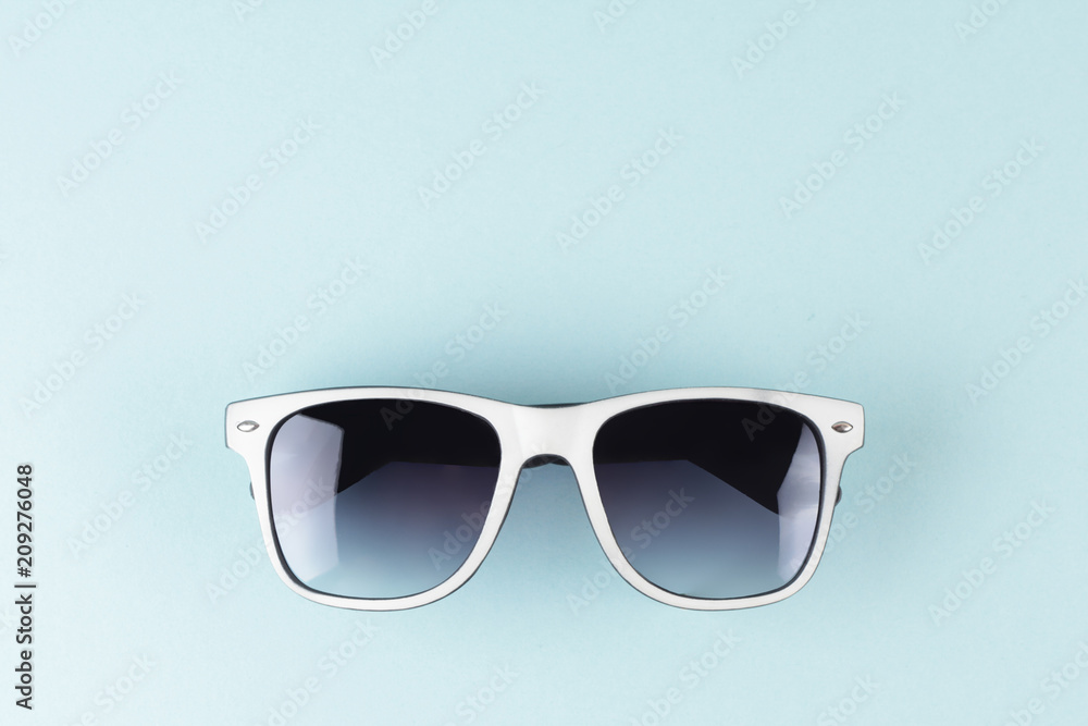 Sunglasse with blue background. Vacation minimalistic concept. Copy space Sunglasse with blue background. Vacation minimalistic concept. Copy space