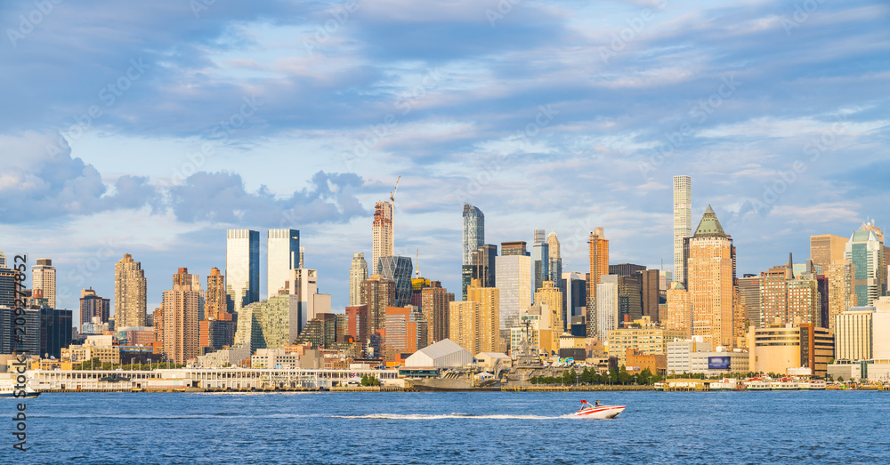 Fototapeta premium new york,usa, 08-25-17: new york city skyline at night with reflection in hudson river.