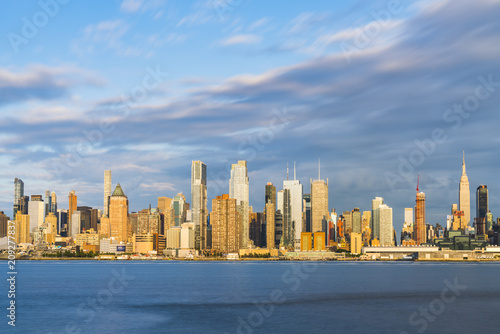 new york,usa, 08-25-17: new york city skyline  at night with reflection in hudson river. © checubus