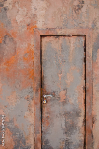 Rusty metal door, forming an effective abstract pattern