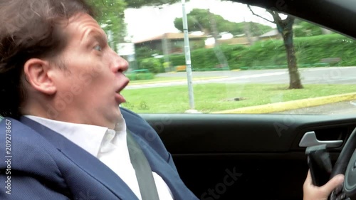 Man driving car talking on the phone almost making crash