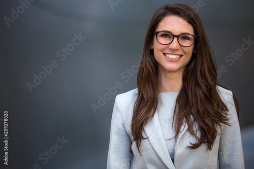 Warm likable commercial friendly portrait of a smart beautiful natural woman, business executive person photo