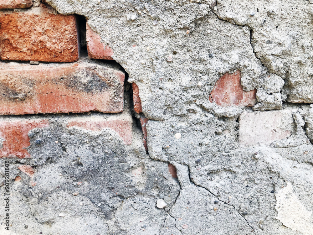 Piece of a ruined brick old wall background Piece of a ruined brick old wall background