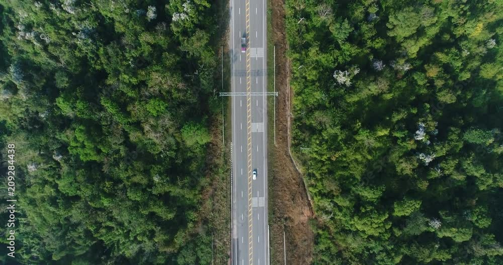 Aerial view country road in forest Aerial view country road in forest