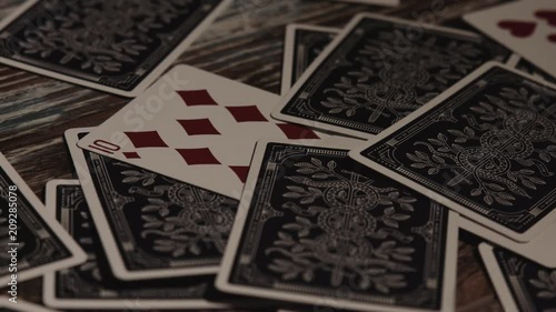 Playing Cards on Wooden Surface