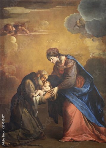REGGIO EMILIA, ITALY - APRIL 13, 2018: The painting of Madonna with the Saint Felice di Cantalice in church Chiesa di Santo Stefano by Alessandro Tiarini (1577 - 1668). photo