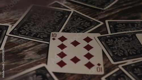 Playing Cards on Wooden Surface