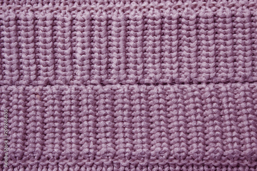 Pink knitting wool texture background.